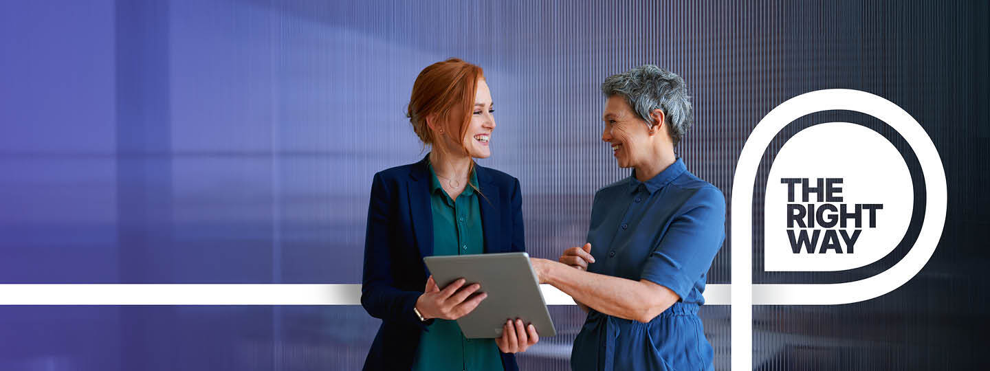 TS_RM_2025_Two_Women_Laptop_Standing_Web_Banner_Horiz_1440x540